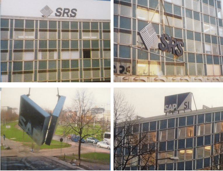 Das neue Firmenlogo der SAP SI wird auf dem Bürogebäude der ehemaligen SRS montiert.