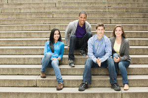 Four Young Friends Sitting on Steps
