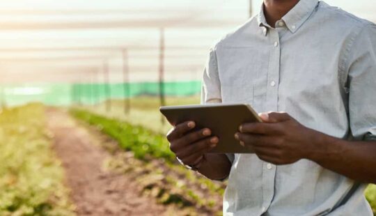 Cropped portrait of a handsome young male farmer using a tablet while working on his farm