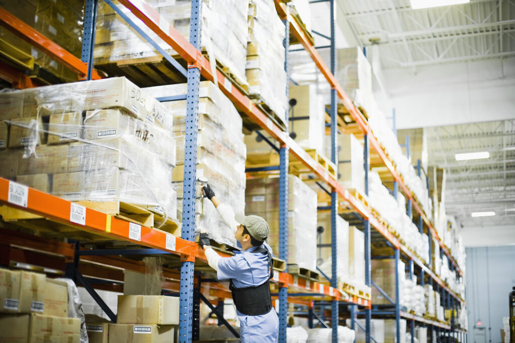 Warehouse worker scanning barcodes; e-invoicing