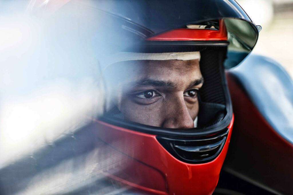 Close-up of competitive racecar driver