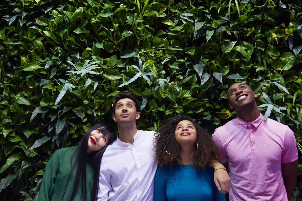 group of young adults looking up