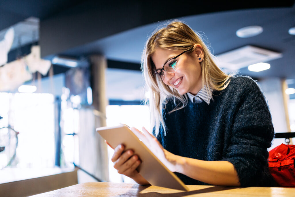 Smiling woman using tablet