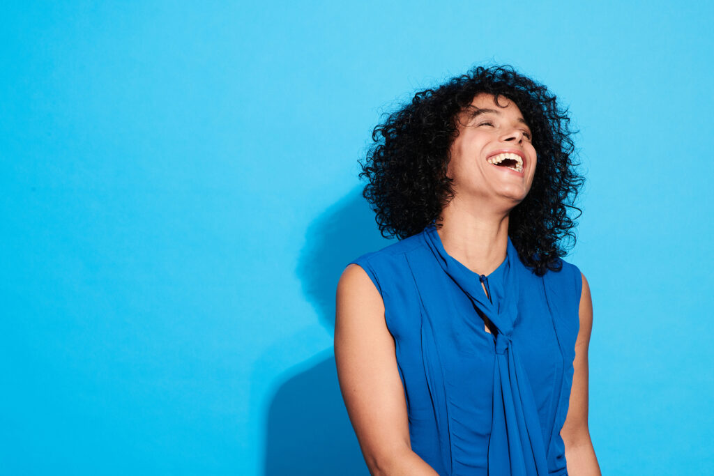 Woman laughing and smiling