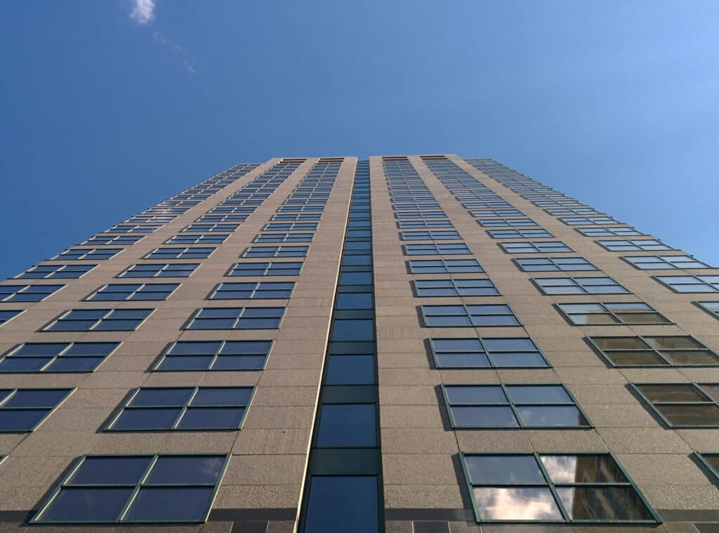 Low Angle View Of Modern Building Against Clear Blue Sky