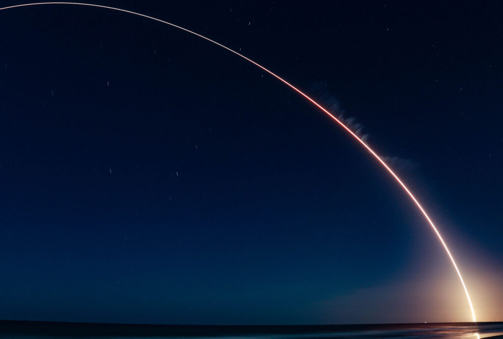 Space shuttle launch at night