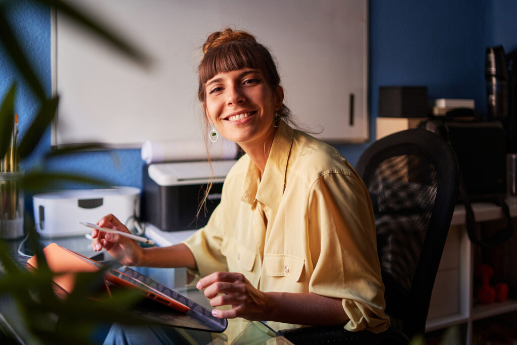 Woman working from home using tablet