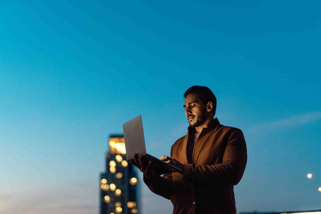 Businessman using computer at rooftop