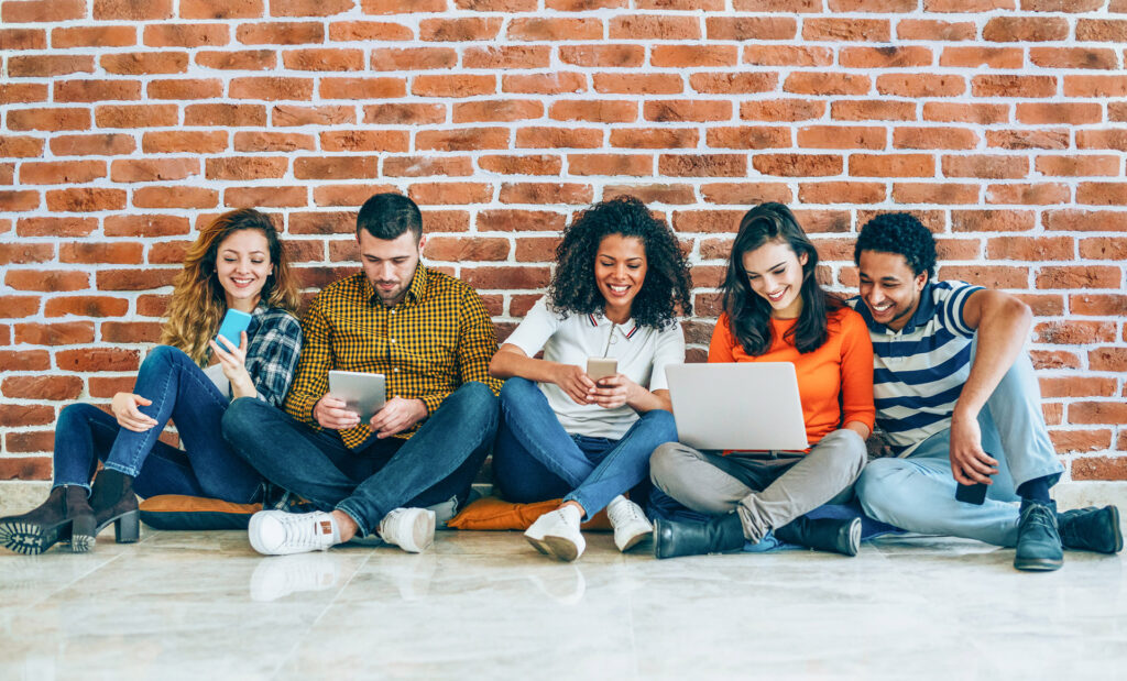 Group of students using mobile devices