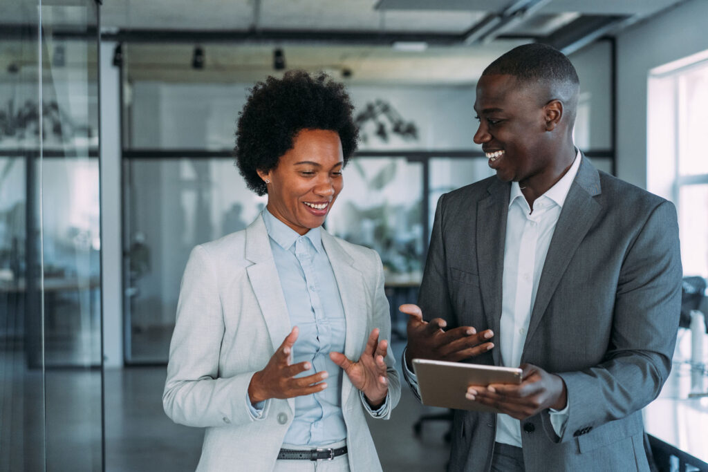 Two business persons talking in the workplace