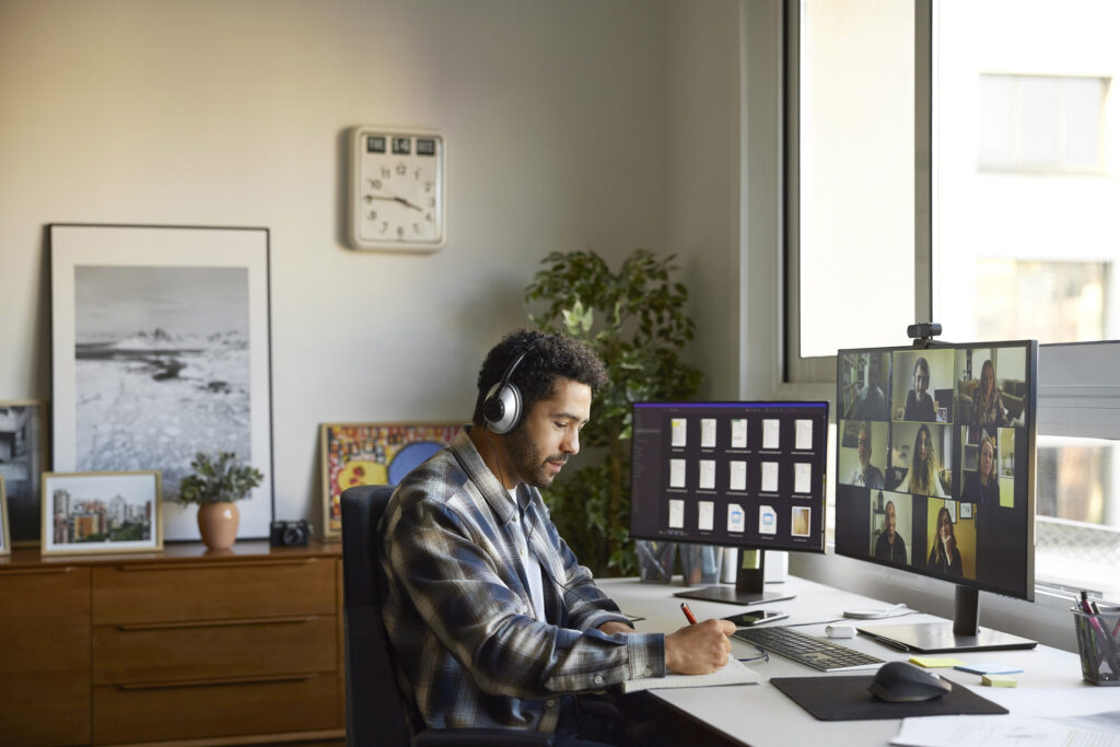 Person working at home in virtual meeting